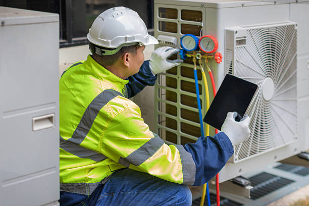 Professional Heat Pump Repair technician working in Osgood, IN